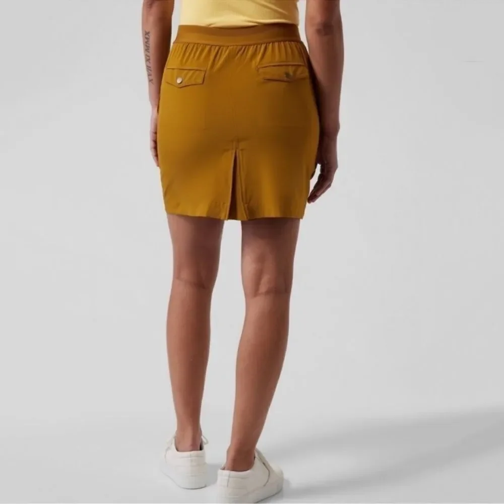 NWT Athleta Vienna Cargo Pocket Mini Skort in Gold Size 12